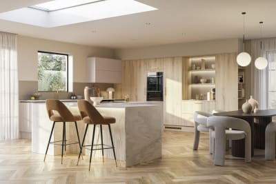 Modern Portobello Bosco kitchen with grey and brown designer chairs and Integra Soho Shell cabinetry.