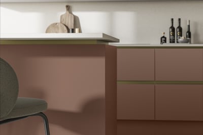 Modern and minimalist Integra Soho Clay kitchen, a frameless slab door with integrated handles in a smooth paint finish.