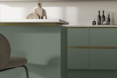 Modern and minimalist Integra Soho Eucalyptus green kitchen, a frameless slab door with integrated handles in a smooth paint finish.