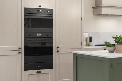 Traditional Shaker-style kitchen range Ludlow with tactile woodgrain in neutral shade Shell with a green Thyme kitchen island.