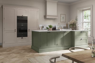 Traditional Shaker-style kitchen range Ludlow with tactile woodgrain in neutral shade Shell with a green Thyme kitchen island.