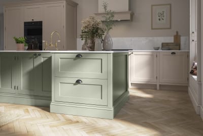 Traditional Shaker-style kitchen range Ludlow with tactile woodgrain in neutral shade Shell with a green Thyme kitchen island.