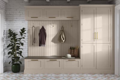 Entrance hallway with Magnet Wardley cabinetry, wall panel, top cabinets and seating bench with large drawers, all matching in the warm light beige shade Shell.