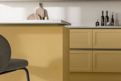Integra Dunham Harvest, a handleless shaker frontal with brass details and a white worktop..