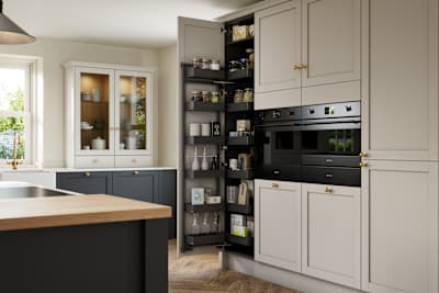 Contemporary Shaker kitchen island Ambleside from Magnet in deep blue shade Lake with beige tall cabinets, herringbone wood flooring and wood diningroom table
