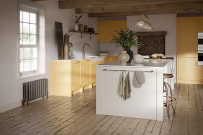 Open floorplan shaker kitchen in the bright and beautiful yellow shade Harvest, paired with a kitchen island with matching frame door cabinets in the shade Limestone.
