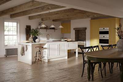 Open floorplan shaker kitchen in the bright and beautiful yellow shade Harvest, paired with a kitchen island with matching frame door cabinets in the shade Limestone.
