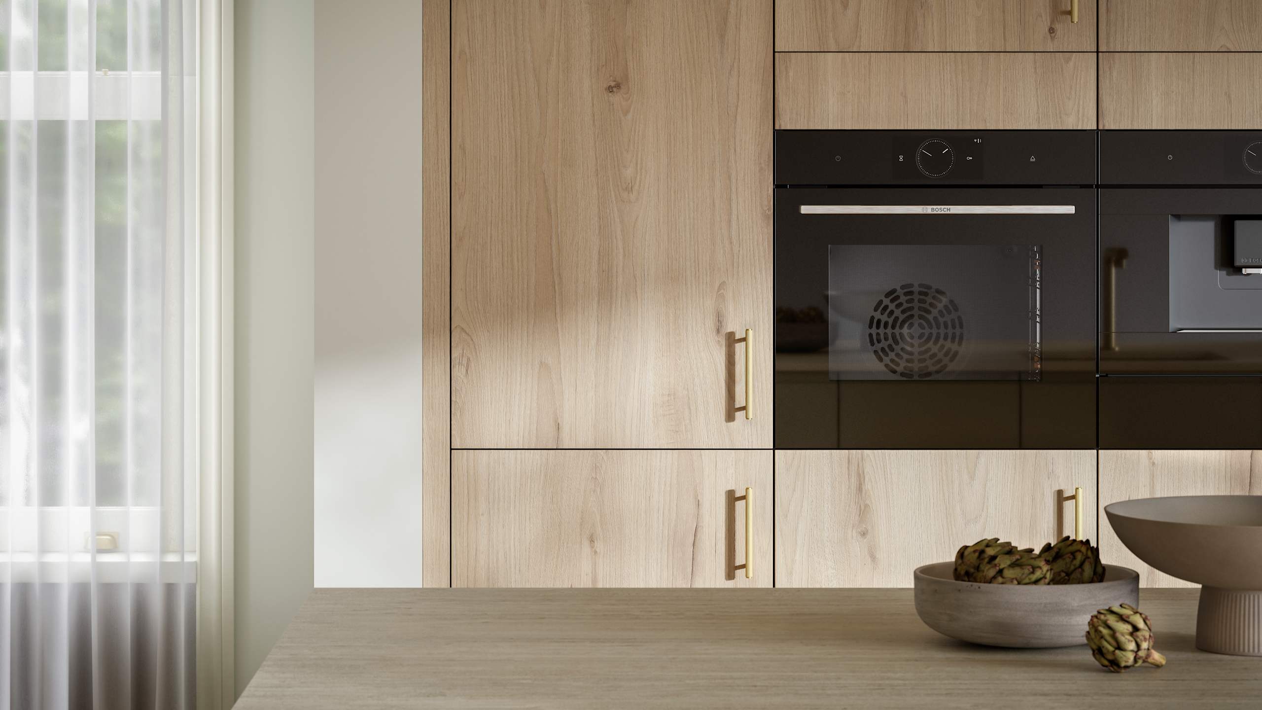 Magnet's modern Portobello kitchen in a light woodgrain décor, finished with brass bar handles.