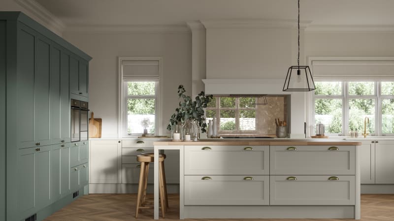 Ambleside kitchen range shown in a home kitchen with blue Shaker cabinets and wood floors.