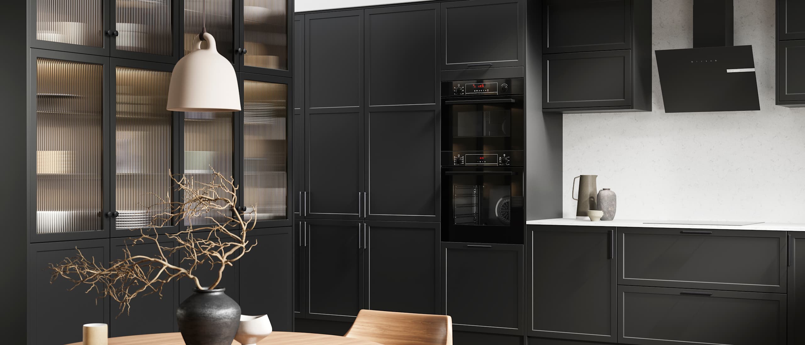 View of modern shaker kitchen Brunswick Sumi Black, with screen extractor over induction hob, tall fluted glass doorsvitrine cabinets, black frame skylights with wood dining table and chairs in foreground.