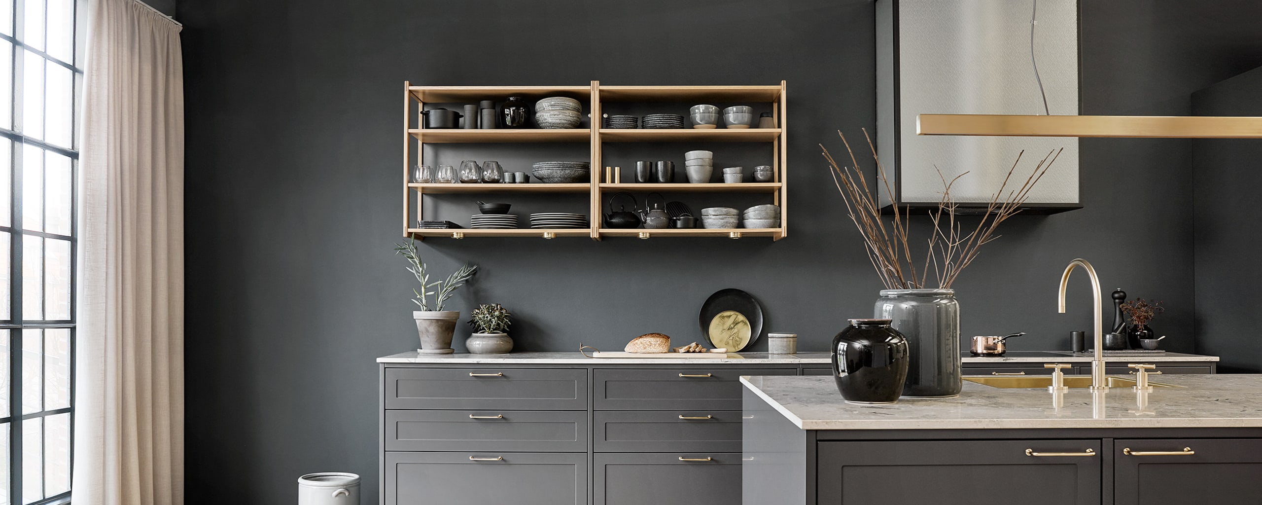 Anthracite grey Shaker kitchen with brass handles