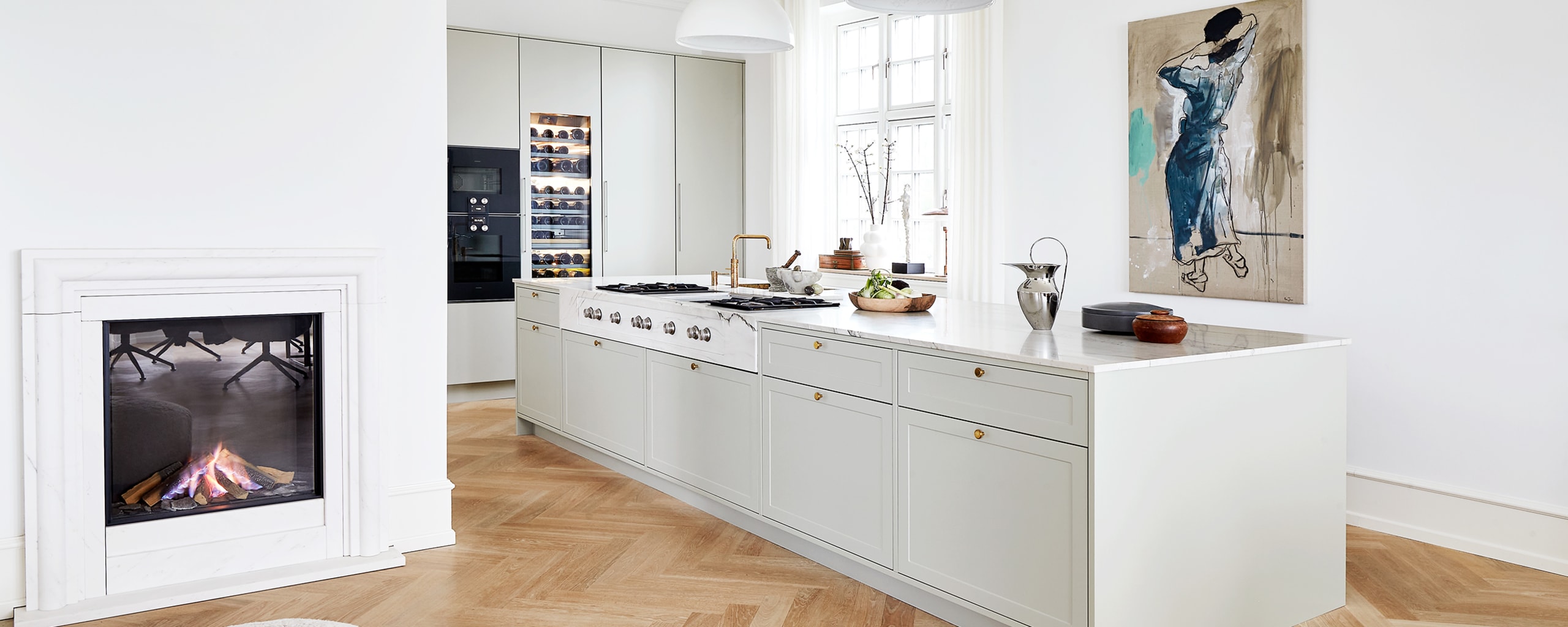 A bespoke kitchen in a classic, Nordic design that matches the mansion's original architecture from the beginning of the 20th century.
