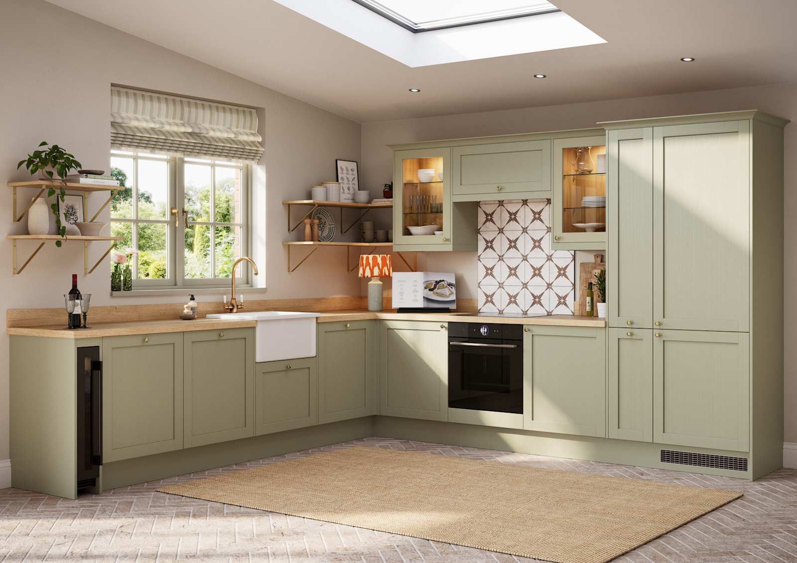 Contemporary Shaker kitchen Ambleside from Magnet in sage green shade Meadow with belfast sink, aged taps and wooden effect worktop.