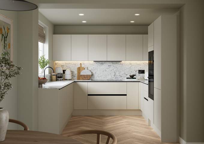 Open plan light neutral shade fluted kitchen with integrated appliances, white and grey marble worktop and upstand. Herringbone wood flooring.