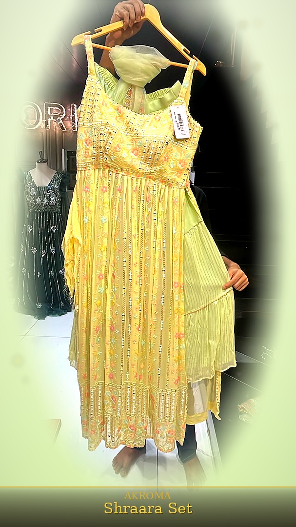 AKROMA Celebration Ensemble — lime yellow embroidered outfit with mirror work and matching wrap