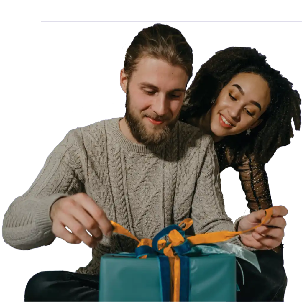 A couple opening a gift together