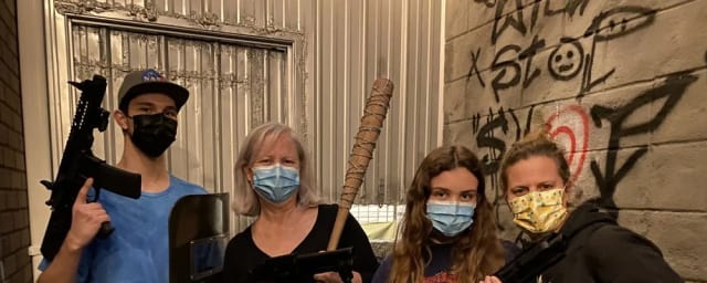 posed group photo with props inside escape room venue — King's Eye Escape, from its own website