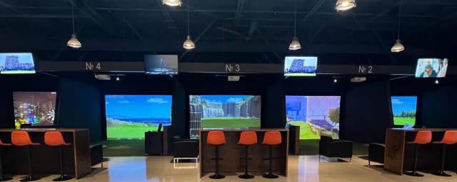 venue interior showing golf simulator bays — Swing Center Indoor Golf, from its own website