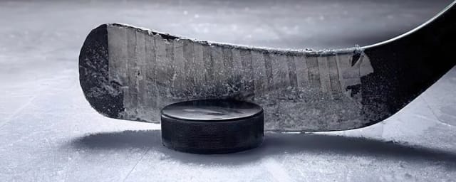 hockey stick and puck on ice — Oakland Ice Center, from its own website