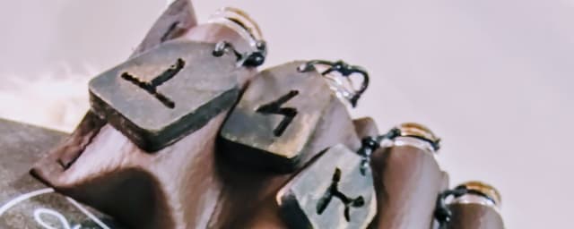 product photo of handmade rune pendants/charms — Reed Between The Lines, LLC, from its own website