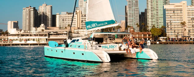 sailing charter catamaran on water — Malarky Charters, from its own website