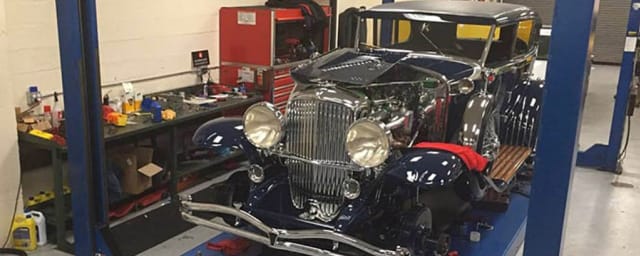 vehicle in workshop at automobile museum — Academy of Art University Automobile Museum, from its own website