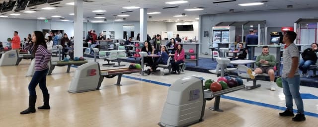 venue interior - bowling lanes in use — Orbit Lanes, from its own website