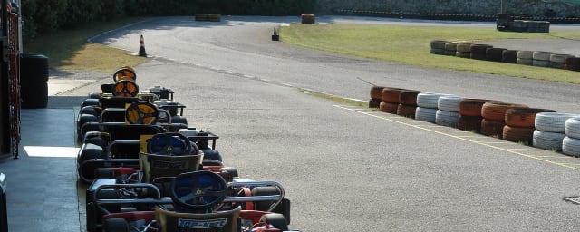 go-karts lined up at track — Fast Lap Indoor Kart Racing, from its own website