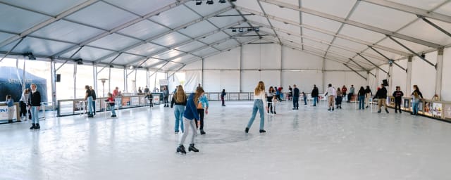 ice rink with skaters — Peltzer Ice Rink | CLOSED until November, 2026!, from its own website