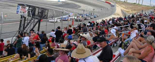 race track with cars racing, viewed from grandstand — Kevin Harvick's Kern Raceway, from its own website