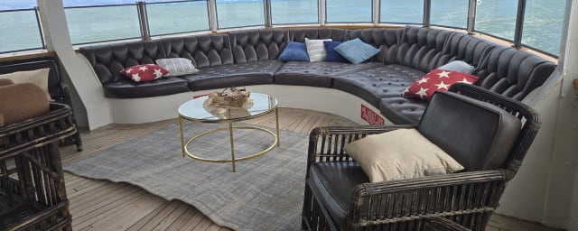 venue photograph - deck lounge area of ship — USS Potomac, from its own website