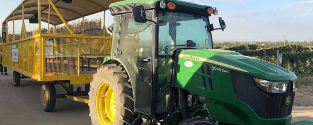 tractor-pulled hay/tour wagon at farm — Murray Family Farms, from its own website