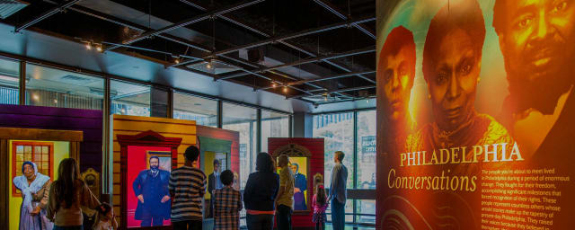 photograph of museum gallery interior with visitors — African American Museum in Philadelphia, from its own website