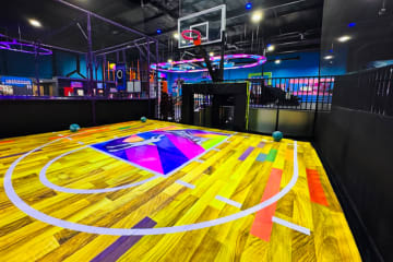 multi-sport court with basketball hoop