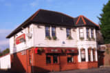 The Torrance Inn logo