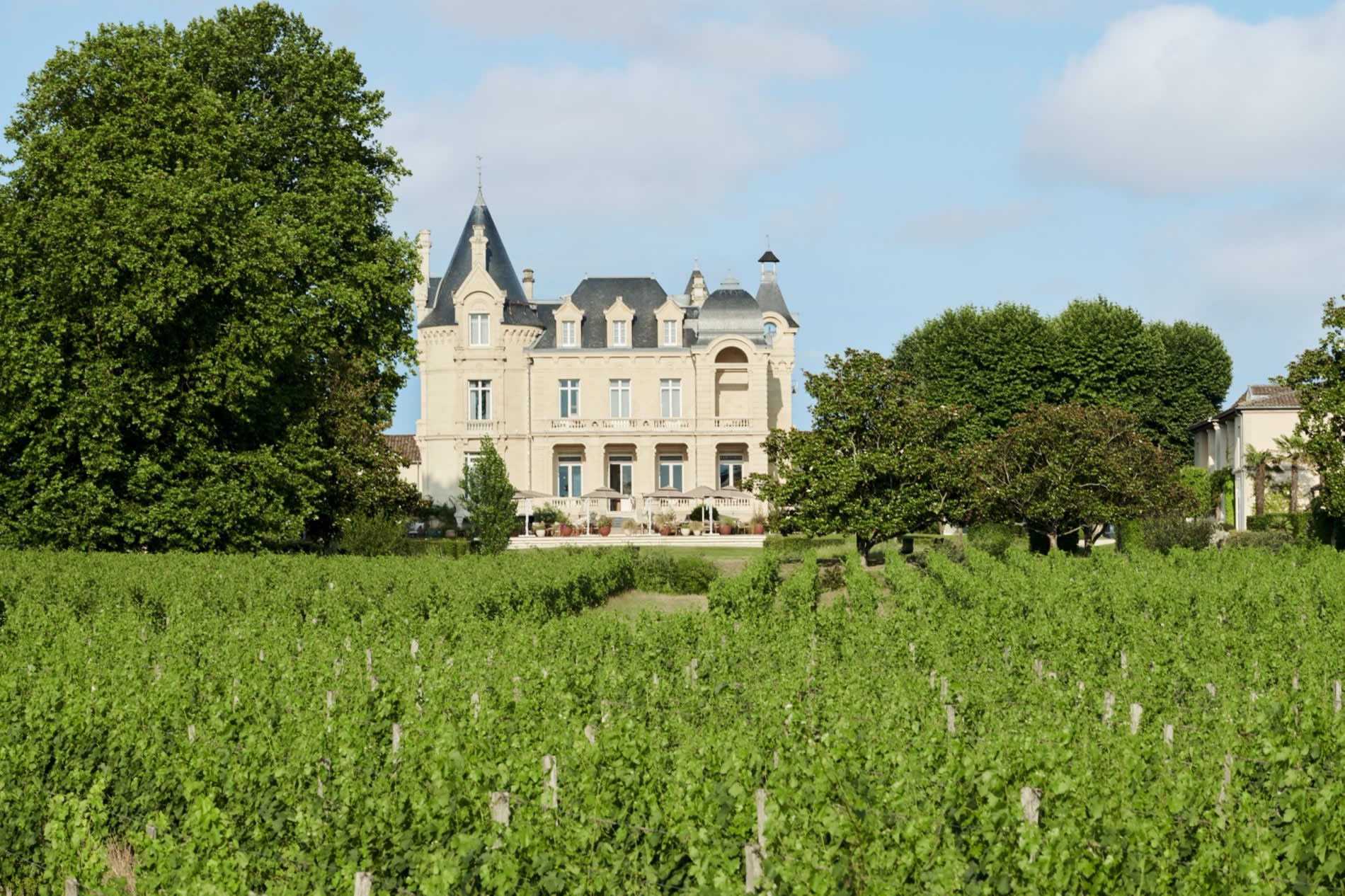 The Château Hôtel Grand Barrail seen across the Saint-Émilion vineyards, near Bordeaux