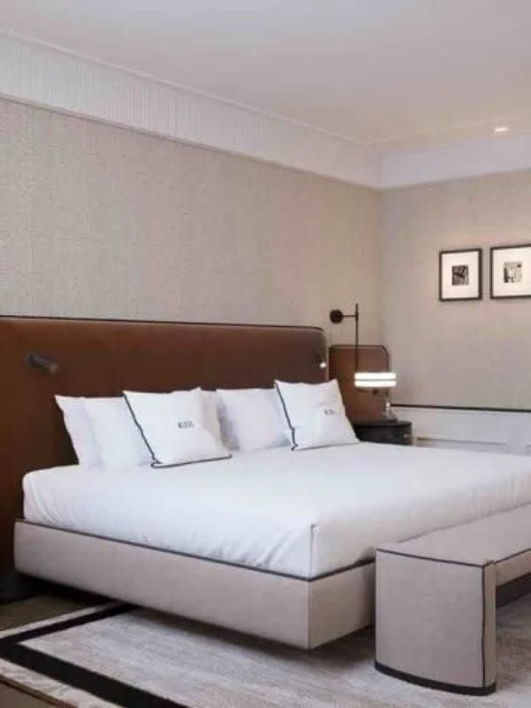 The Deluxe Terrace City View room at BLESS Barcelona and its bed dressed in white