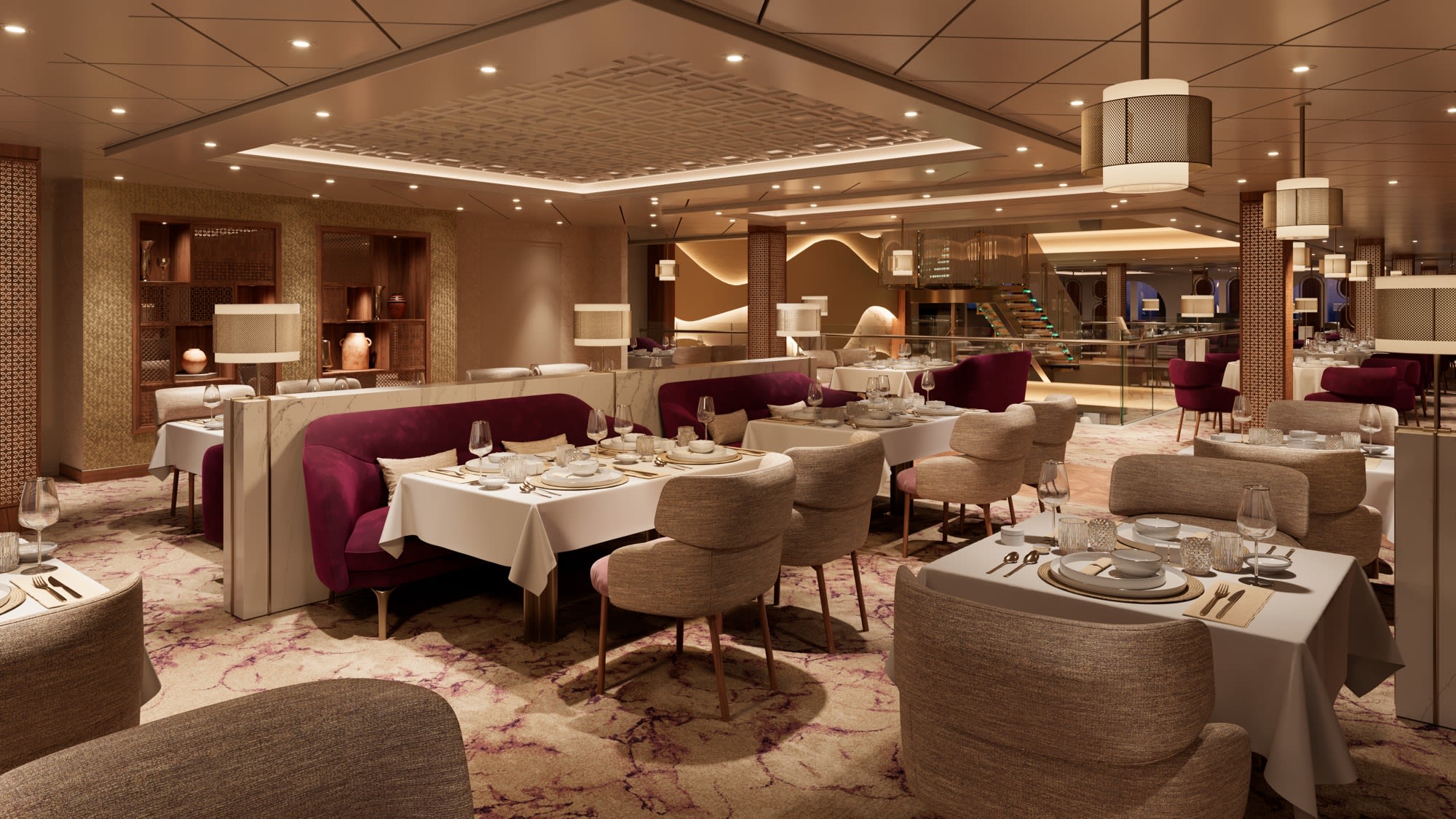 Restaurant gastronomique Khuzama à bord de l'AROYA, banquettes en velours et tables dressées