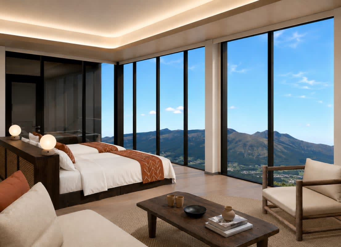 Le salon d'une suite d'Aso Retreat HONO ouvert sur les montagnes d'Aso, au Japon