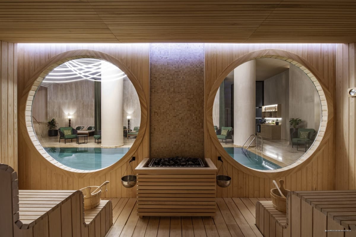 Swissôtel spa with light wood circular portholes, illustrating the Crafting Pure Living philosophy