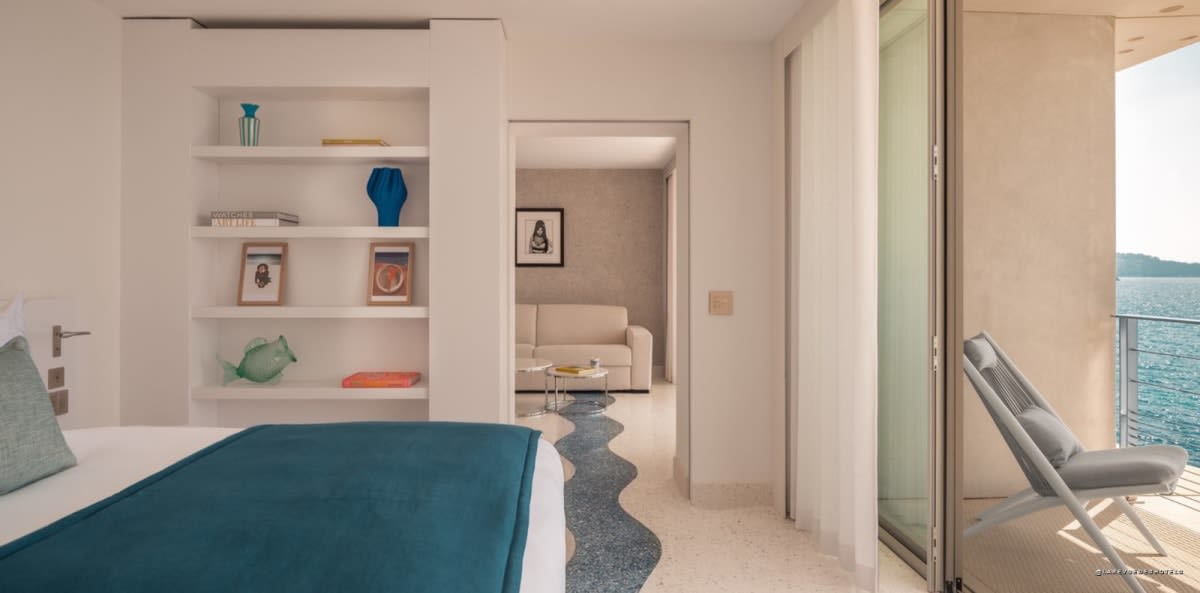 Suite at Hôtel Les Roches with adjoining living room and sea view
