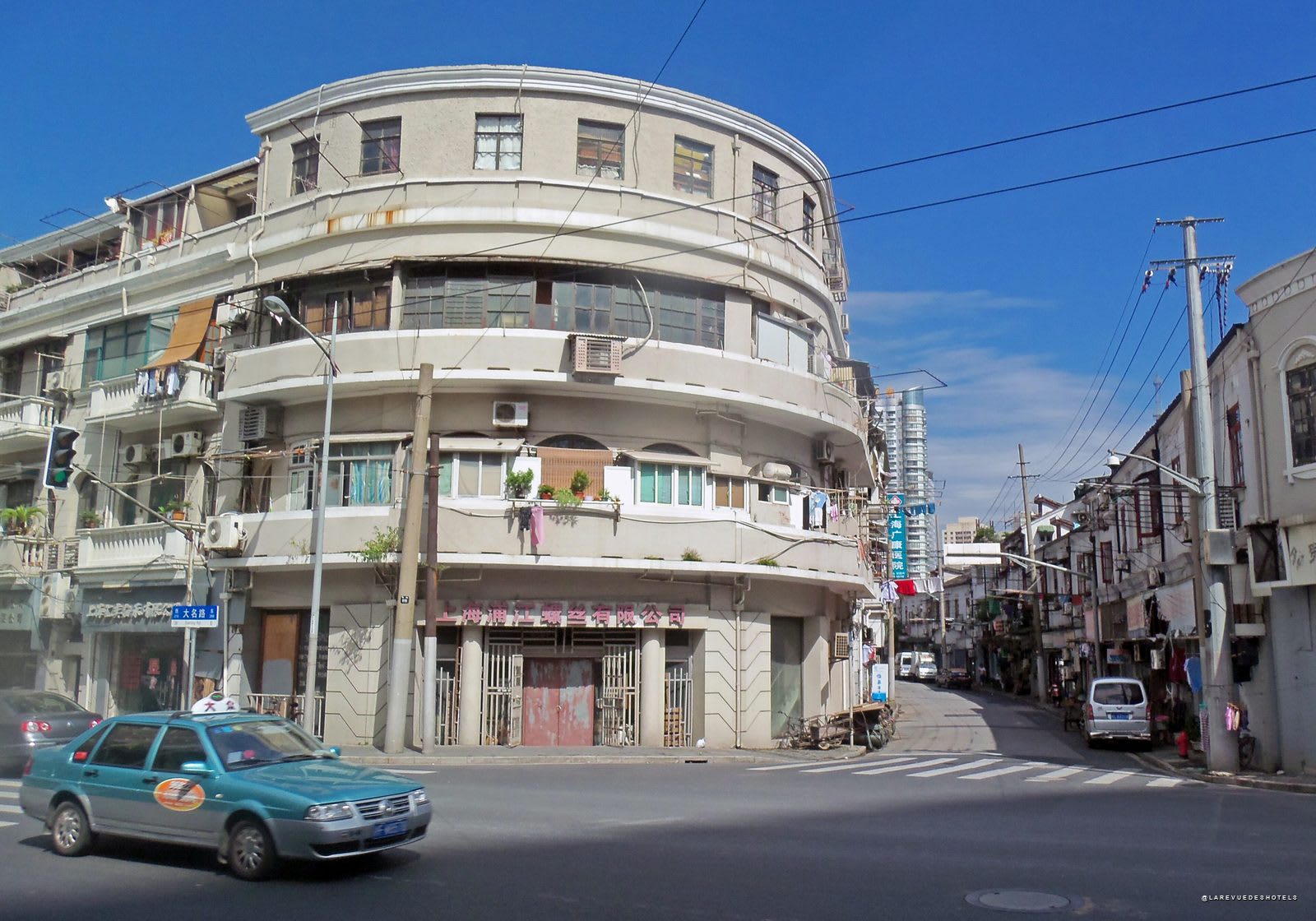 A curved 1930s building on the corner of Daming Road, in Shanghai's Hongkou District