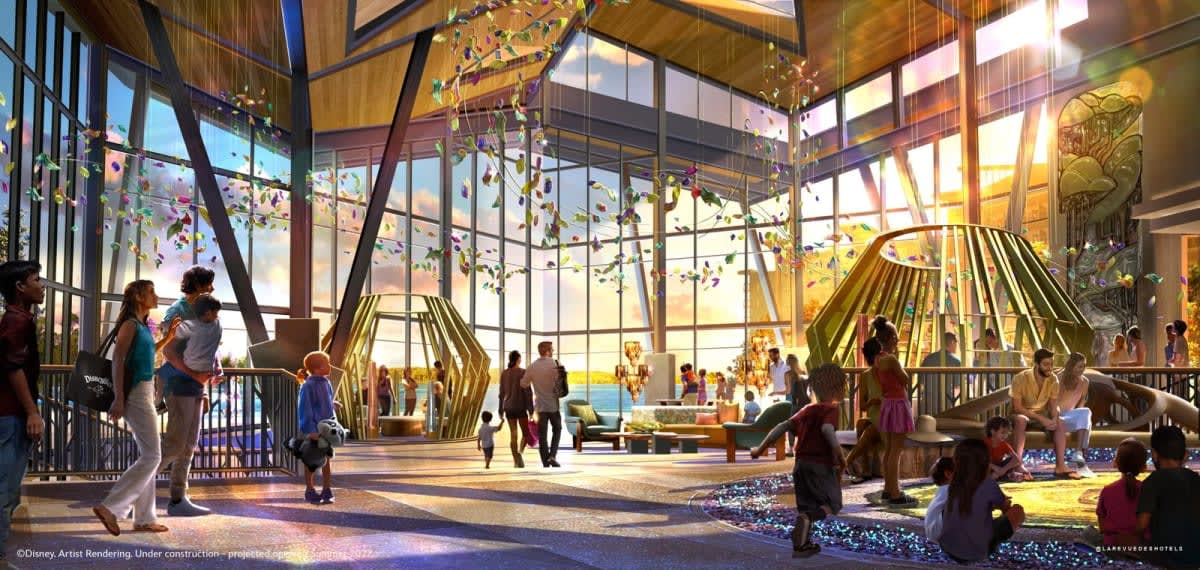 The glass-walled lobby, opening onto the lake