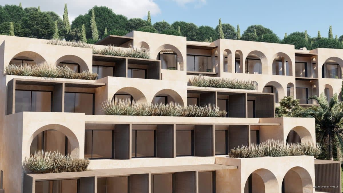 Les façades à arches et terrasses plantées de l'Ella Elyra
