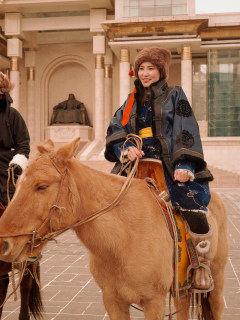mongolian woman on a horse