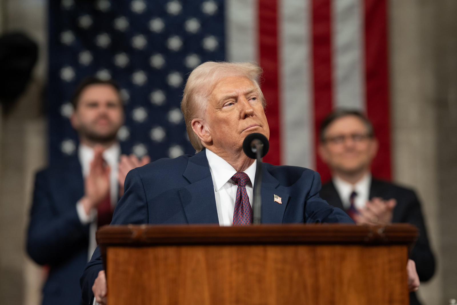 Romanian police officer in uniform with protest banners Romanian police officer in uniform with protest banners