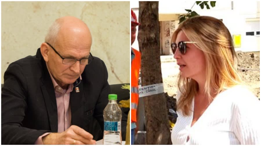 Femeie în birou, înconjurată de documente și echipamente de birou