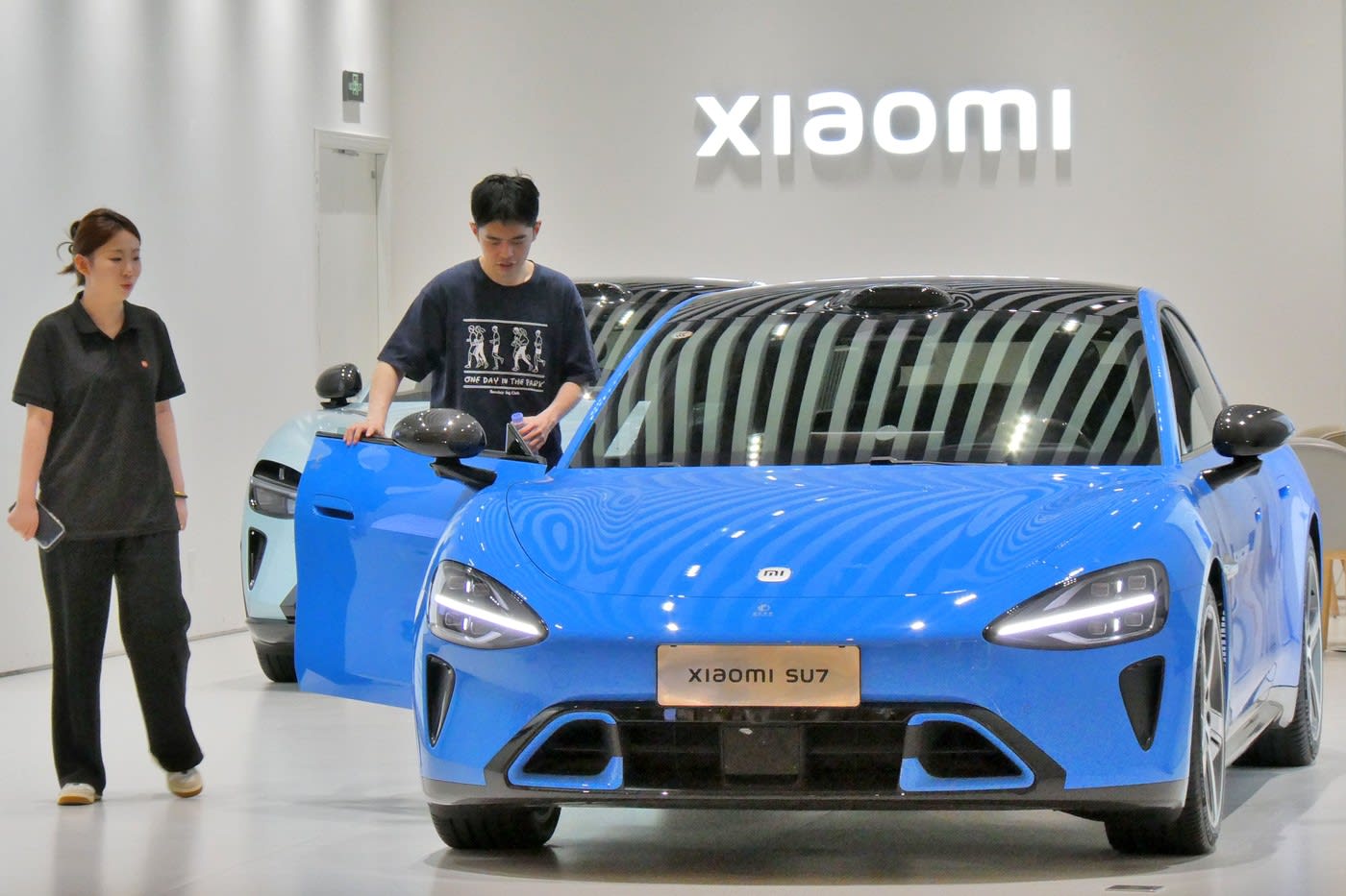 Blogger chinez în fața tribunalului, vehicul Xiaomi electric