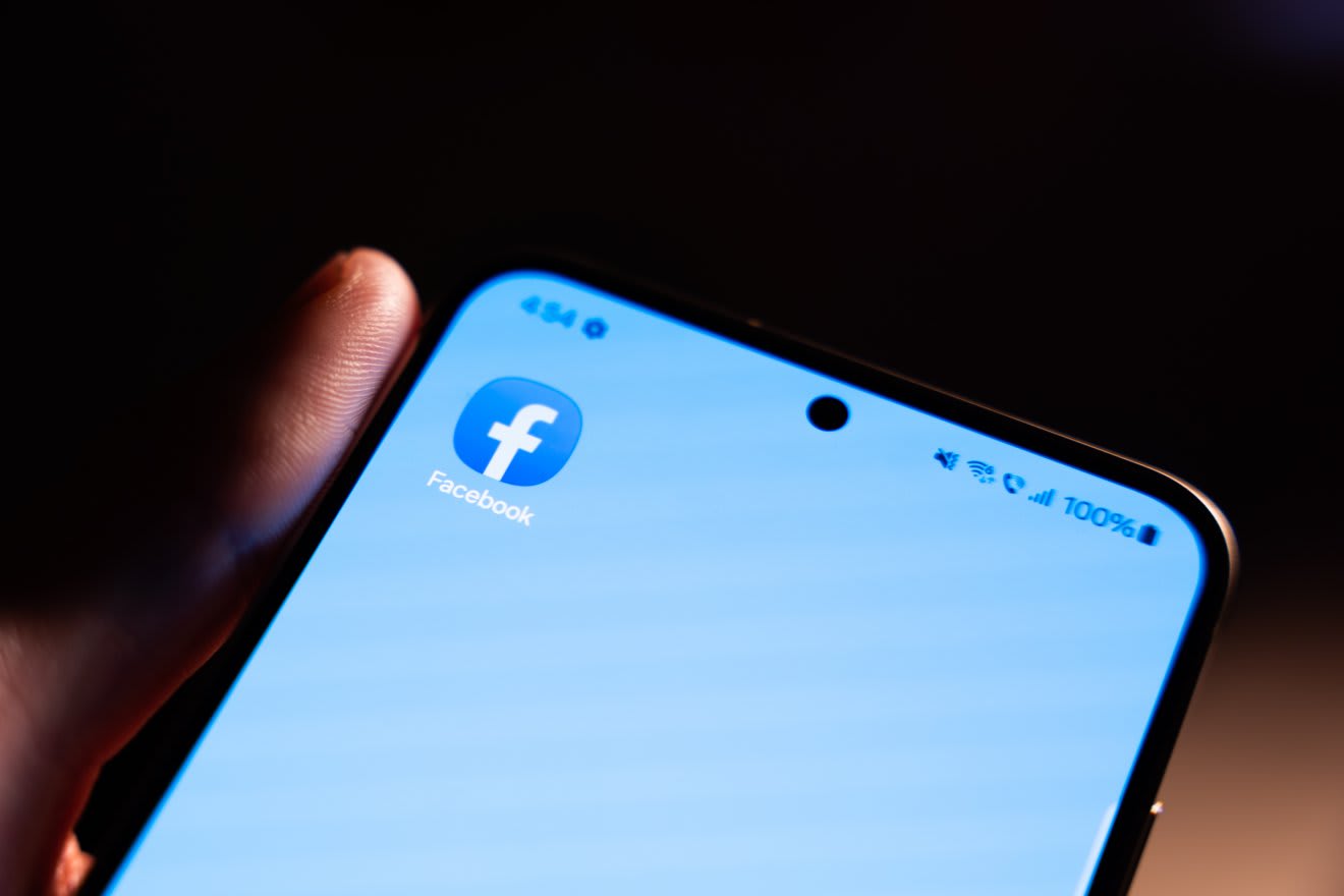 Facebook logo on a smartphone screen Facebook logo on a smartphone screen