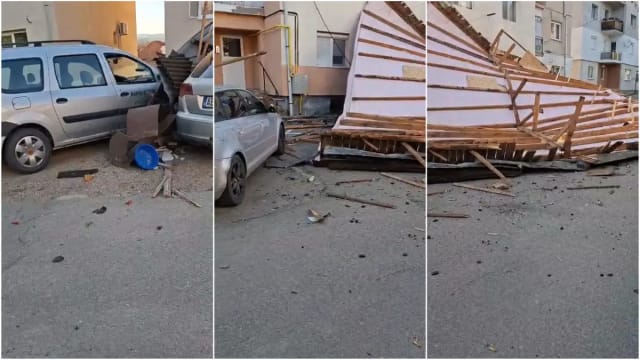 Vântul puternic a doborât acoperișul unui bloc din Ocna Mureș, peste mașini